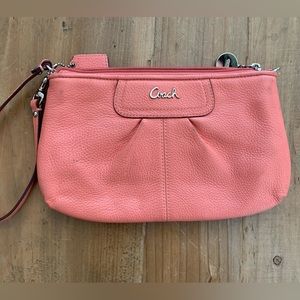 Super cute pink Coach wristlet with card slots!
